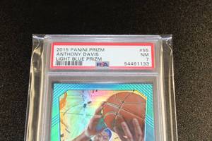 lot 5 image: 2015 Prizm Light Blue Prizm Anthony Davis PSA 7