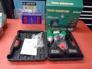 lot 10 image: Tool Kingdom 21 volt 38 cordless impact wrench with 2 batteries, charger & accessories. Was a show display. As shown.