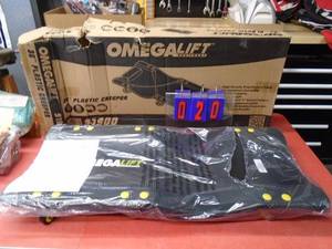 lot 20 image: Omega plastic creeper. New in box. 300lb. Was a show display. As shown.