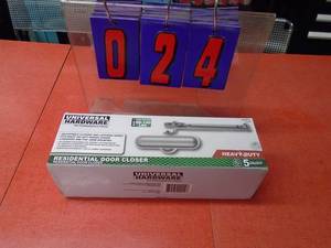lot 24 image: Universal hardware heavy duty door closer. Brown in color. New in box. As shown.