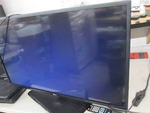 lot 4 image: Lg 42 inch tv with remote powers on...