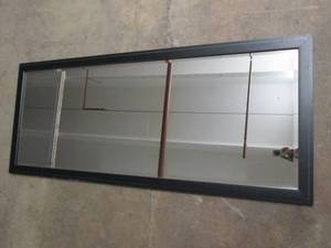 lot 38 image: 62 inch x 25.5 inch mirror...