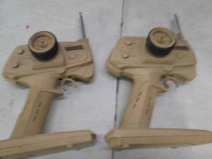 lot 69 image: 2 brown remotes ...