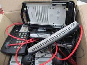 lot 95 image: box of avaya phones, wifi routers a...