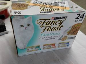 24 Cans Friskies Cat food...