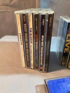 Lot of CDs and Tape Cassettes Plus Portable CD Holder