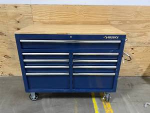 lot 18 image: HUSKY 46 in. W x 24.5 in. D 9-Drawer Gloss Blue Deep Tool Chest Mobile Workbench with Hardwood Top