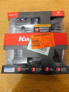 lot 47 image: Kwikset Tustin Venetian Bronze ExteriorEntry Door Handle and Single Cylinder Deadbolt Combo Pack Featuring SmartKey Security