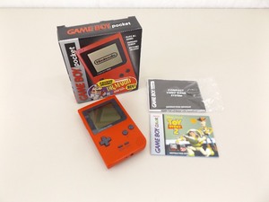 lot 23 image: Vintage Gameboy Pocket Red With Original Box, Manual, and Toy Story Game