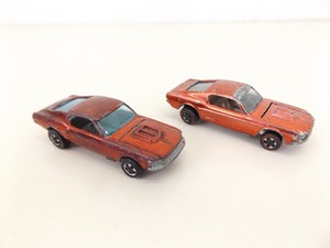 lot 101 image: 2 Original Hot Wheels Redlines Custom Mustang Red and Magenta Variations