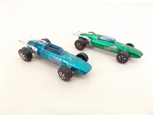 lot 105 image: 2 Original Hot Wheels Redlines Indy Eagle Green and Aqua Color Variations