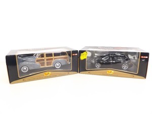 lot 147 image: 2 NRFB Maisto Premier 118 Scale Die Cast Woody and Porsche Cars