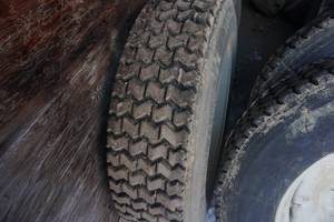 lot 10 image: Set of 4  - Samson Brand Skid Loader Plow Tires and Rims IN ALMOST NEW CONDITION