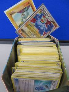lot 13 image: TIN POKEMON BOX WITH CARDS