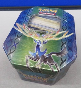 lot 14 image: POKEMON TIN PLUS CARDS