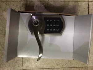 lot 45 image: Defiant Castle Satin Nickel Electronic Touchpad Door Lever