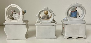 lot 131 image: Three Victorian Fairing Trinket Boxes including Boehme Fairing Box Paddling His Own Canoe