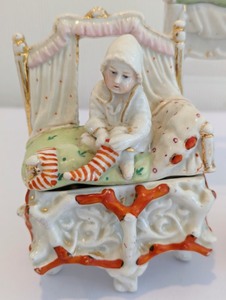 lot 253 image: Victorian Children in Bed Themed Fairing Trinket Boxes