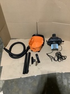 lot 32 image: RIDGID 4 Gallon 5.0-Peak HP Portable WetDry Shop Vacuum with Fine Dust Filter, Hose and Accessories. See Pictures