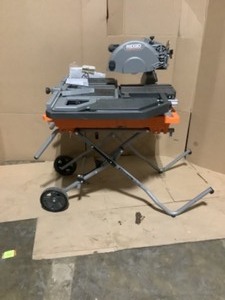 lot 57 image: RIDGID 10 in. Wet Tile Saw with Stand. See Pictures