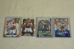 lot 105 image: Mac Jones Rookie Cards - Prizm, Score, Absolute