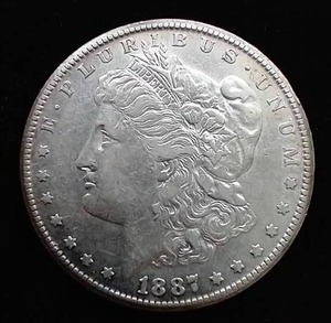 lot 49 image: 1887-S Morgan Dollar