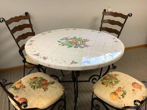 lot 11 image: Tiled Top Wrought Iron Table w 4 Wrought Iron and Wood Chairs