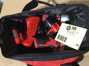 Milwaukee M12 12-Volt Lithium-Ion Cordless Drill DriverImpact Driver Combo Kit w Two 1.5Ah Batteries, Charger Tool Bag (2-Tool) not used see pictures