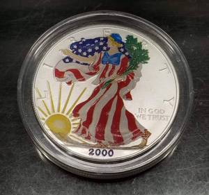 lot 11 image: 2000 COLOR ENHANCED AMERICAN SILVER EAGLE 1 OZ .999 FINE SILVER IN AIRTITE