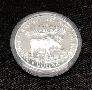 lot 22-A image: 1985 CANADA NATIONAL PARKS MOOSE SILVER DOLLAR IN ORIGINAL PACKAGING
