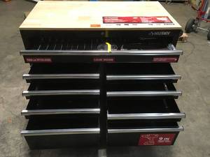Husky 46 in. W x 24 in. D 9-Drawer Gloss Black Deep Tool Chest Mobile Workbench with Hardwood Top dentdamage on the side corner and back see pictures