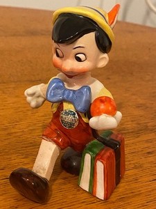 lot 12 image: Variety of Collectible Pinocchio Figurines