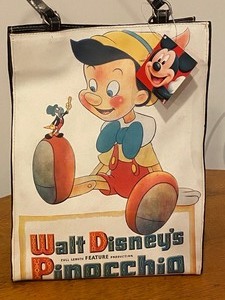 lot 24 image: Pinocchio Themed Handbag and Matching Wristlet