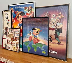 lot 58 image: Framed Pinocchio Memorabilia and Movie Posters