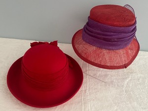 lot 394 image: Two Red Had Society Hats