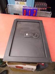 lot 13 image: Wall mount bio metric safe. New in box. Chip in paint. No key. Print pad lights up. As shown.