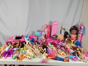 Large Assortment of Barbies, Dolls, and More