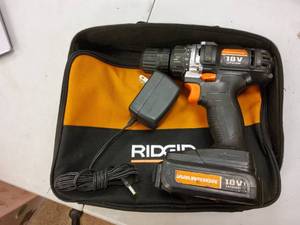 Warrior keyless chuck drill, charging cord, and battery.