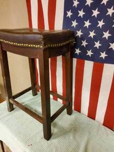 Bar stool with leather seat.