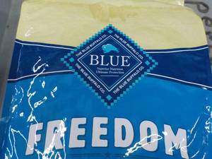 lot 129 image: 24 lb. Bag Blue Freedom Dog Food...