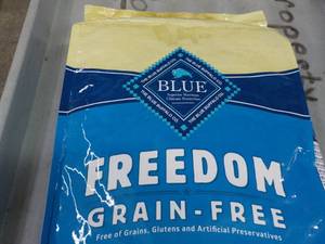 lot 131 image: 24 lb. Bag Blue Freedom Dog Food...