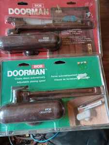 Two New Ryobi Doorman Door Closers in Original Packages