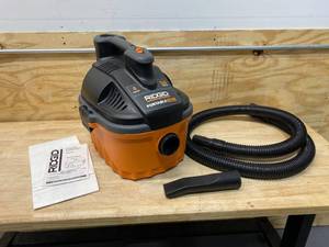 lot 73 image: RIDGID 4 Gal. 5.0-Peak HP Portable WetDry Shop Vacuum with Filter, Dust Bag, Locking Hose and Car Nozzle