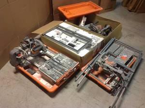 lot 12 image: Lot of assorted Ridgid Tile Saws open box customer returns some maybe missing pieces review pictures