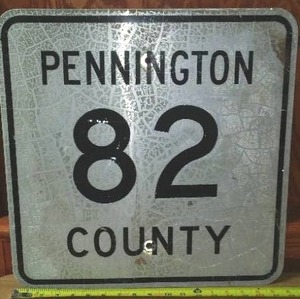 lot 138 image: Metal road sign Pennington County 82.