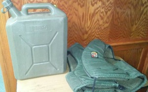 lot 251 image: Jeep 5 gallon tank and Stearns life vest