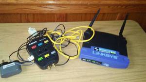 lot 264 image: Linksys 2.4 router and Sanus protected plug in system and cords.