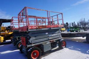 lot 11 image: 2003 Sky Jack Model 7135RT Rough Terrain 4 x 4 Scissors Lift
