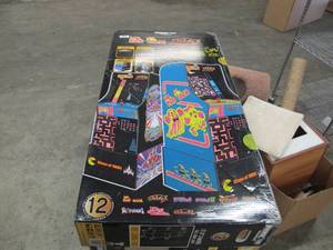 lot 506 image: NEW in Distressed Box Arcade 1Up Ms. Pac-ManGalaga Arcade Console - Unassembled