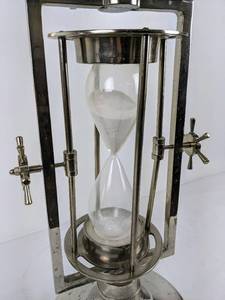 lot 100 image: Dulin ChromeSilver Sand-Timer Accent Table